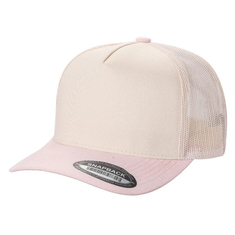 Waycap Mesh trucker hat with a light pink suede bill and a cream front panel. Features a breathable mesh back and adjustable snapback.
